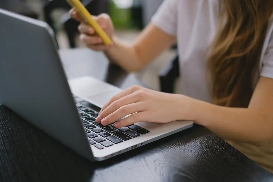 Image of a person typing on a laptop and a hand holding a domain name sign